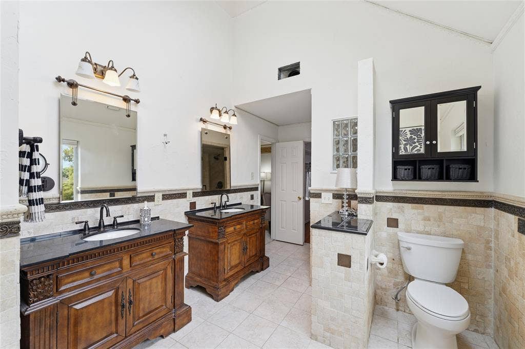1509 Aylesbury Lane, Plano, TX 75075 The primary bath doesn't disappoint, is offers double separate vanities, garden tub and separate shower, and offers a walk-in closet and a nice skylight that offers natural light.