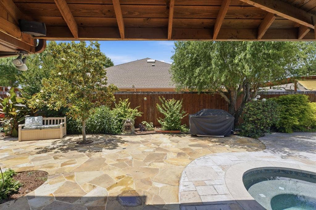 1509 Aylesbury Lane, Plano, TX 75075 Covered patio, and a nice garden shed or pocket office outside.
