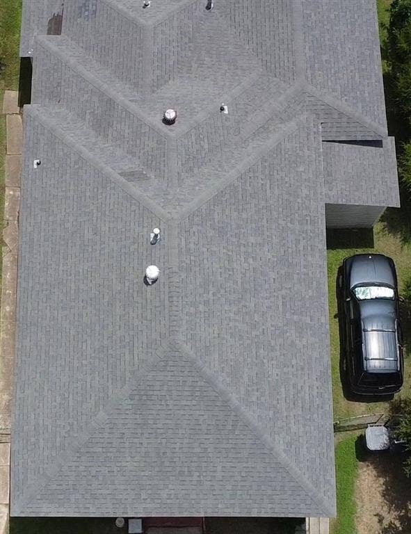 922 Hollywood Avenue, Dallas, TX 75208 Aerial perspective of a multi-gabled architectural roofline featuring composite shingle roofing and integrated ventilation elements