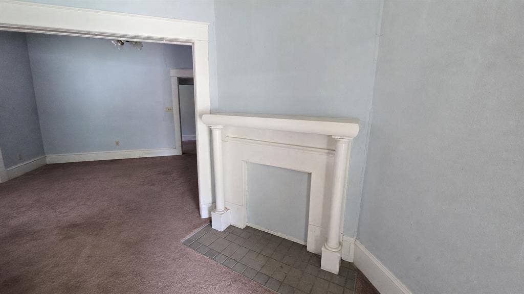 922 Hollywood Avenue, Dallas, TX 75208 Decorative fireplace mantel featuring fluted columns and a tiled hearth