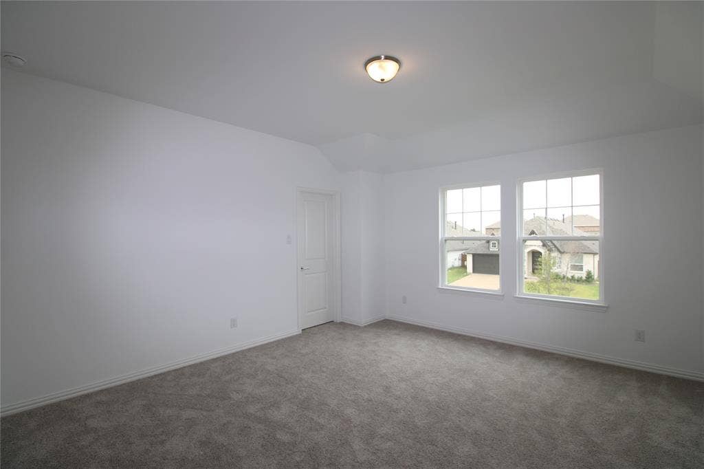 2603 Swallowtail Street, Melissa, TX 75454 Neutral-toned carpeting, crisp white walls, flush-mount ceiling light fixture, and double-paned windows