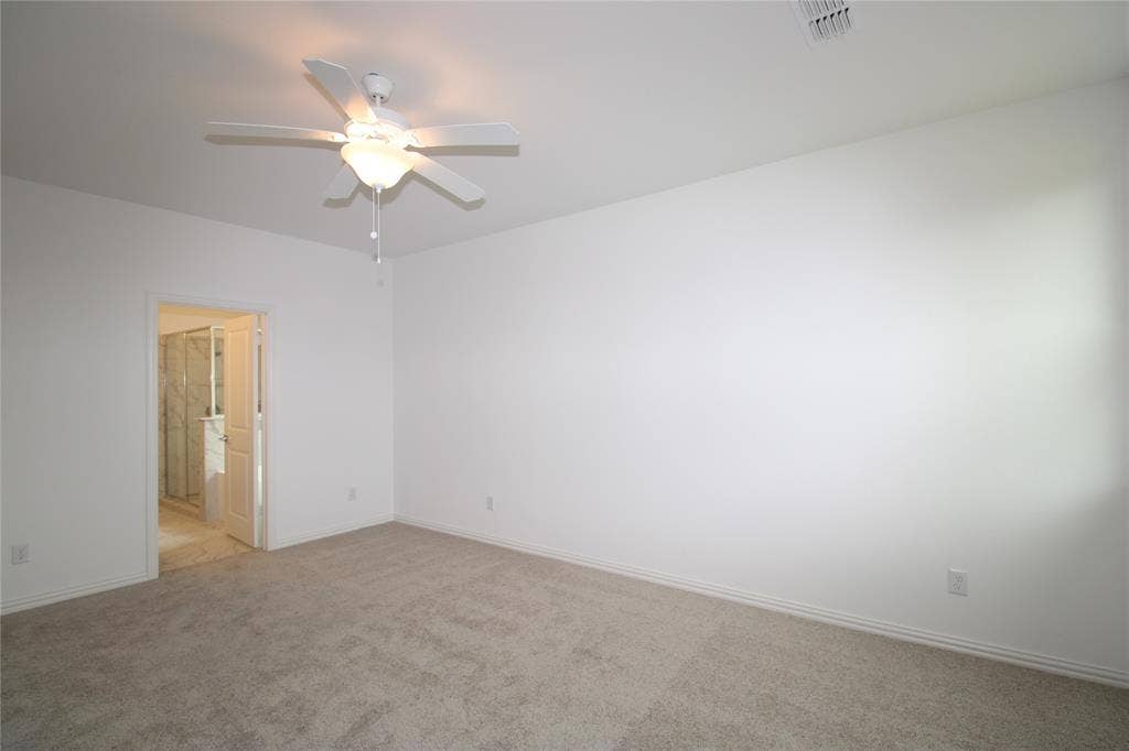 2603 Swallowtail Street, Melissa, TX 75454 Neutral-toned wall-to-wall carpeting, high ceilings, and a central ceiling fan with an integrated light fixture