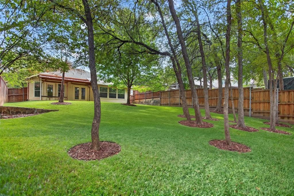 2691 Eganridge Lane, Rockwall, TX 75087 Expansive backyard featuring, beautiful mature trees, wood privacy fencing, and with Greenbelt