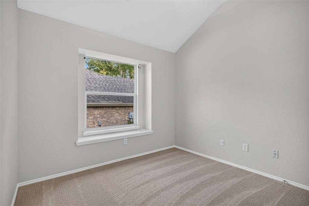 2691 Eganridge Lane, Rockwall, TX 75087 Vaulted ceiling, neutral wall tones, carpeted flooring, and a recessed window with a sill