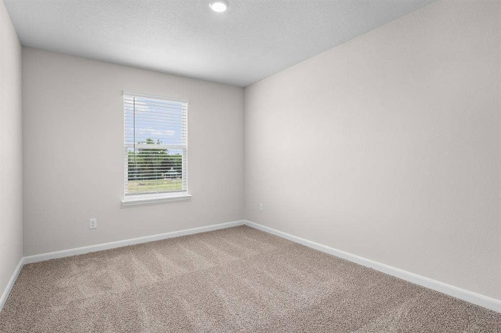 6307 Crosswood Lane, Dallas, TX 75241 Empty room featuring baseboards and carpet floors