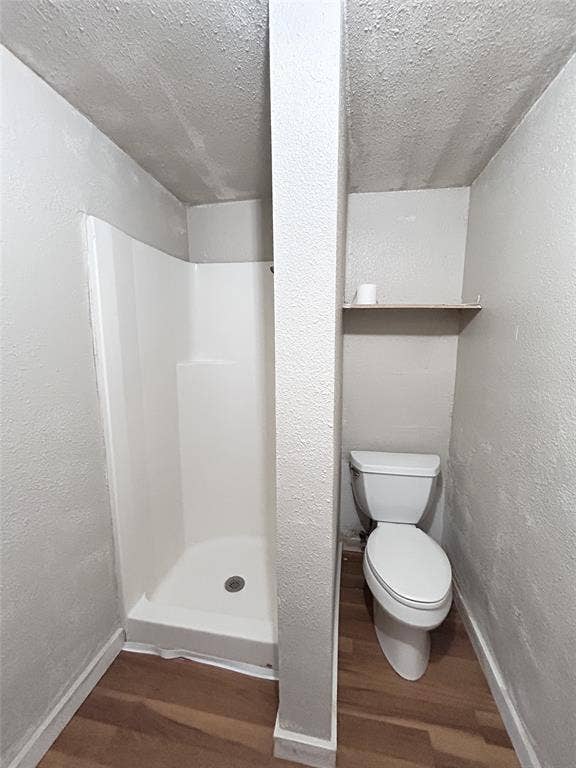 412 N Saint Augustine Drive, Dallas, TX 75217 White molded shower surround with a centered pillar divider, wall-mounted shelving