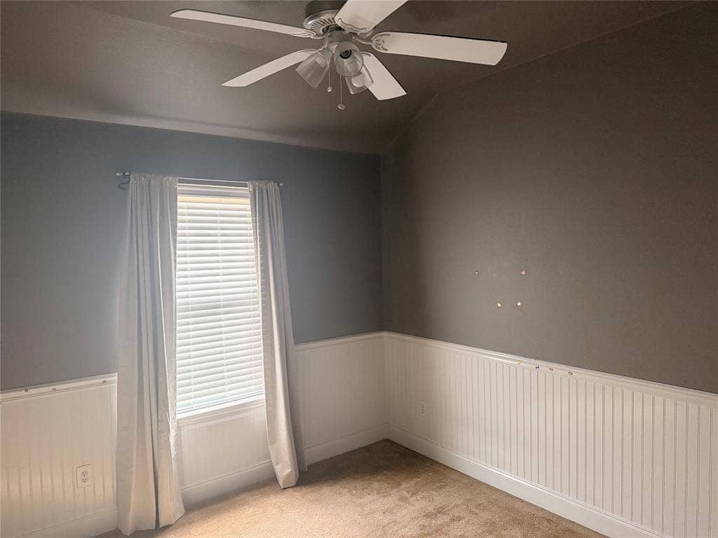 705 Bamboo Drive, Anna, TX 75409 Room featuring neutral wall tones, white beadboard wainscoting, carpeted flooring, a multi-blade ceiling fan, and a single window with blinds