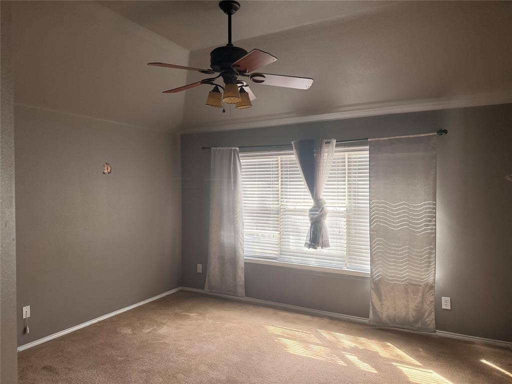 705 Bamboo Drive, Anna, TX 75409 Vaulted ceilings featuring a multi-blade ceiling fan with integrated lighting and a window with horizontal blinds