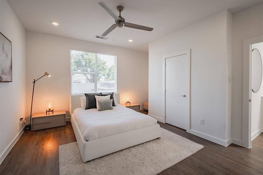 1502 Bennett Avenue, #106, Dallas, TX 75206 Wood-finish flooring, recessed lighting, ceiling fan, and large window with horizontal blinds
