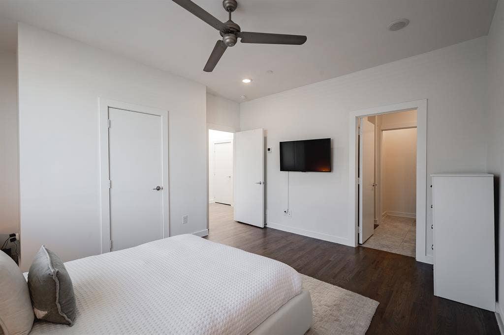 1502 Bennett Avenue, #106, Dallas, TX 75206 Interior space featuring wood-finish flooring, a contemporary ceiling fan, recessed lighting, and multiple interior doorways
