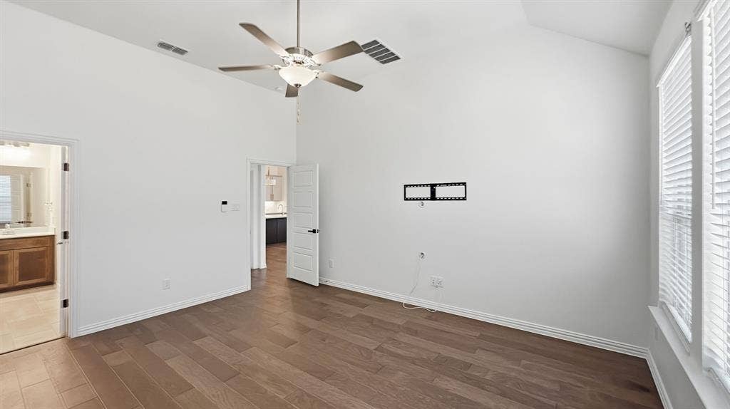 3129 Grayslick Avenue, Celina, TX 75009 Vaulted ceilings, wood-finish flooring, and a ceiling fan with integrated lighting