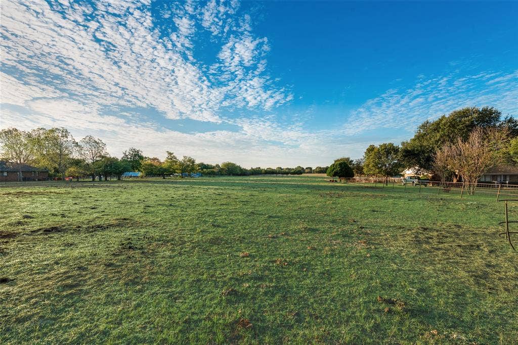 0 Johnson Lane, Ovilla, TX 75154 Expansive open pasture featuring mature trees and perimeter fencing