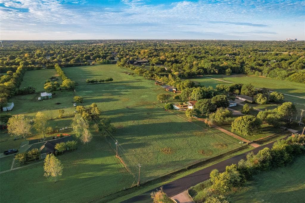 0 Johnson Lane, Ovilla, TX 75154 Expansive parcel featuring level pasture land, mature trees, and perimeter fencing
