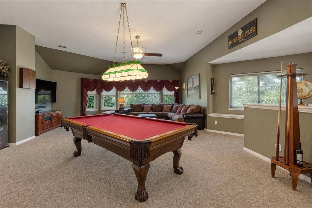 2404 Creek Ridge Drive, McKinney, TX 75072 Vaulted ceilings with recessed lighting, multi-pane window configurations, and a decorative stained-glass billiard light fixture