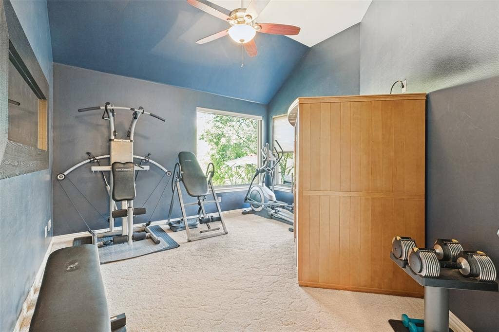 2404 Creek Ridge Drive, McKinney, TX 75072 Vaulted ceilings, built-in wooden sauna, ceiling fan, and large windows providing natural light