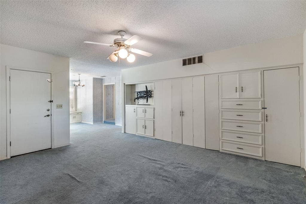 6936 Wildglen Drive, Dallas, TX 75230 Opens to two separate bathrooms, two walk-in closets and great built-ins