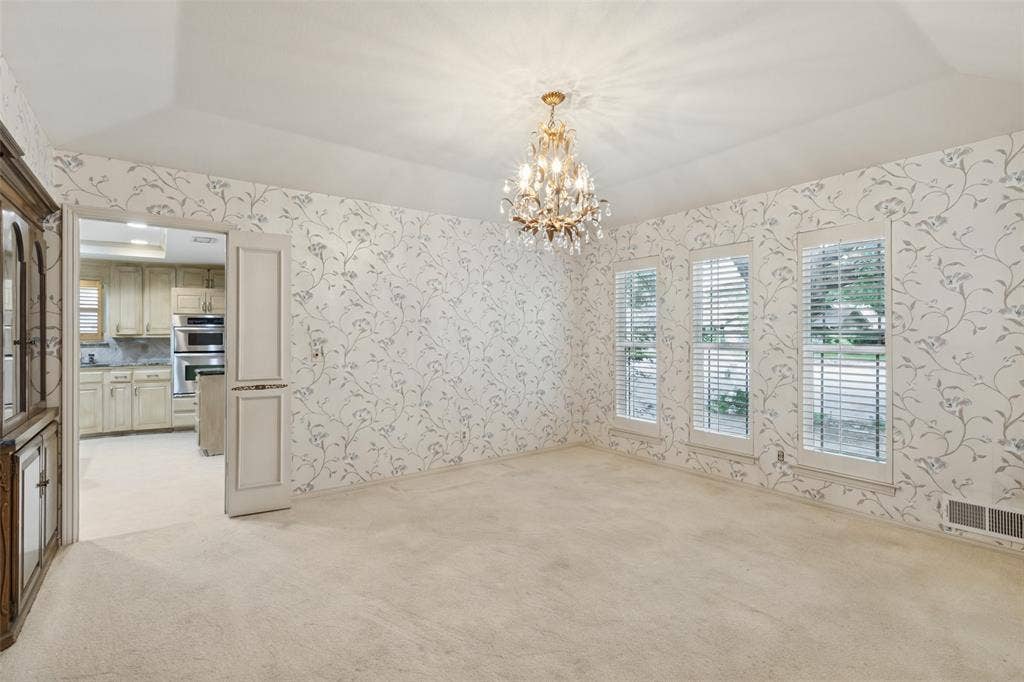 6936 Wildglen Drive, Dallas, TX 75230 Split formal dining room with pretty chandelier