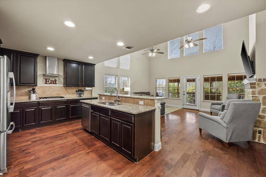 Open floor plan features kitchen opening onto family room