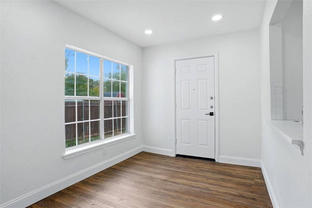 10430 Desdemona Drive, Dallas, TX 75228 Dining room with large window and door to backyard