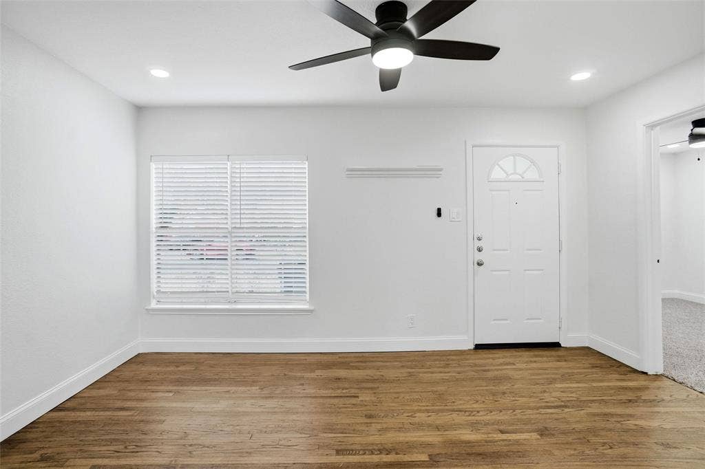 10430 Desdemona Drive, Dallas, TX 75228 Living room with remote control ceiling fan
