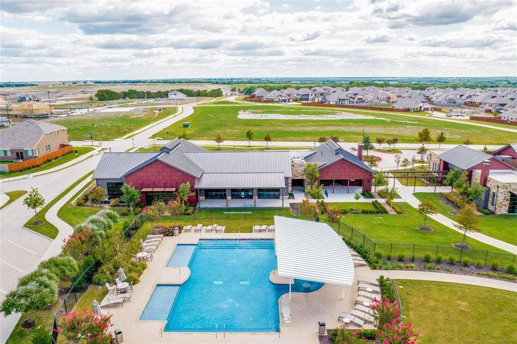 Community amenities featuring a swimming pool, shaded pavilion, and manicured landscaping