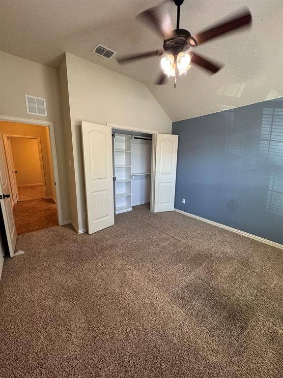 3953 Hollow Lake Road, Fort Worth, TX 76262 Vaulted ceilings, carpeted flooring, built-in closet shelving, and a ceiling fan with integrated lighting