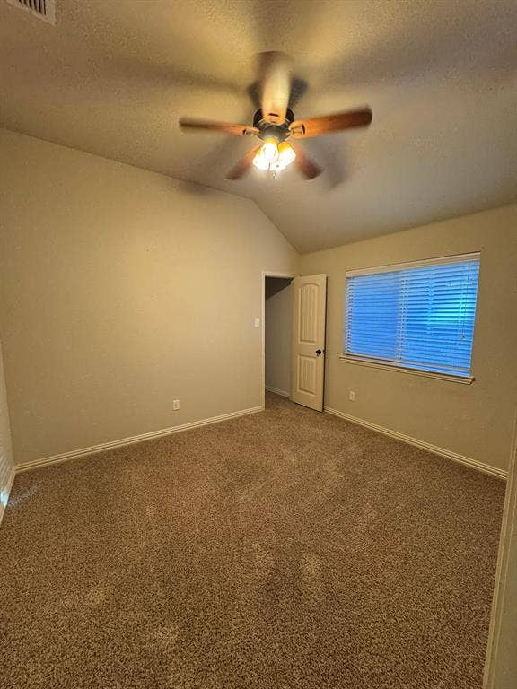 3953 Hollow Lake Road, Fort Worth, TX 76262 Vaulted ceiling with a centrally mounted ceiling fan featuring integrated tri-bulb lighting, neutral carpeting, and window with horizontal blinds