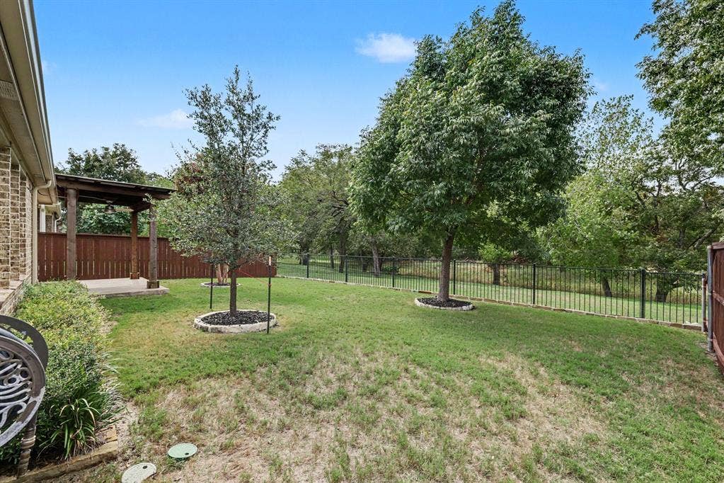 6706 Rutledge Court, Garland, TX 75044 This is what you can come home to each day!Yard with trees and green space with private walking path for neighborhood residents only!