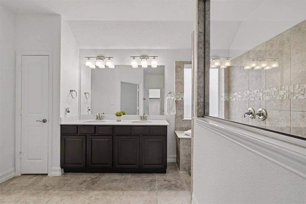 6706 Rutledge Court, Garland, TX 75044 Primary bath with large walk in shower and 2, yes 2 walkin closets!
