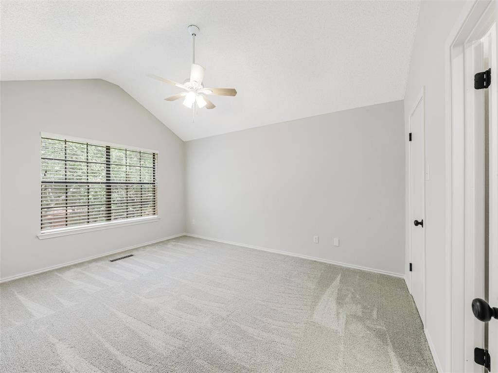 449 Harris Street, #102L, Coppell, TX 75019 Vaulted ceiling, wall-to-wall carpeting, multi-pane window, and central ceiling fan with integrated lighting