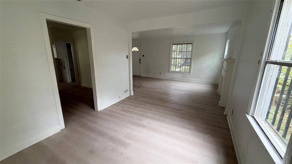 View of dining room adjacent to living room and kitchen