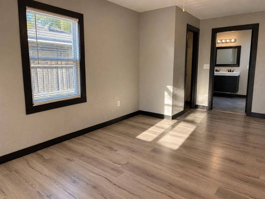 1817 N Alexander Street, Sherman, TX 75092 Another perspective showcasing the primary bedroom’s layout and available space.