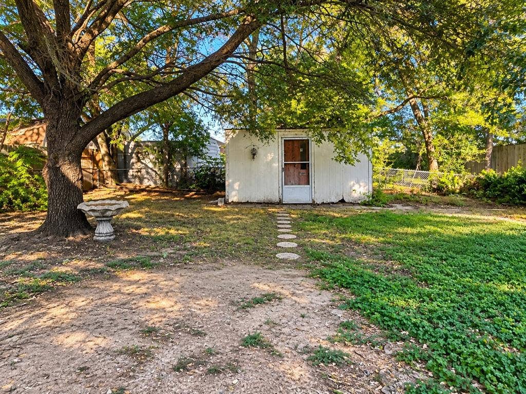 1817 N Alexander Street, Sherman, TX 75092 Outdoor space offering possibilities for gardening, entertaining, or creating your own retreat.