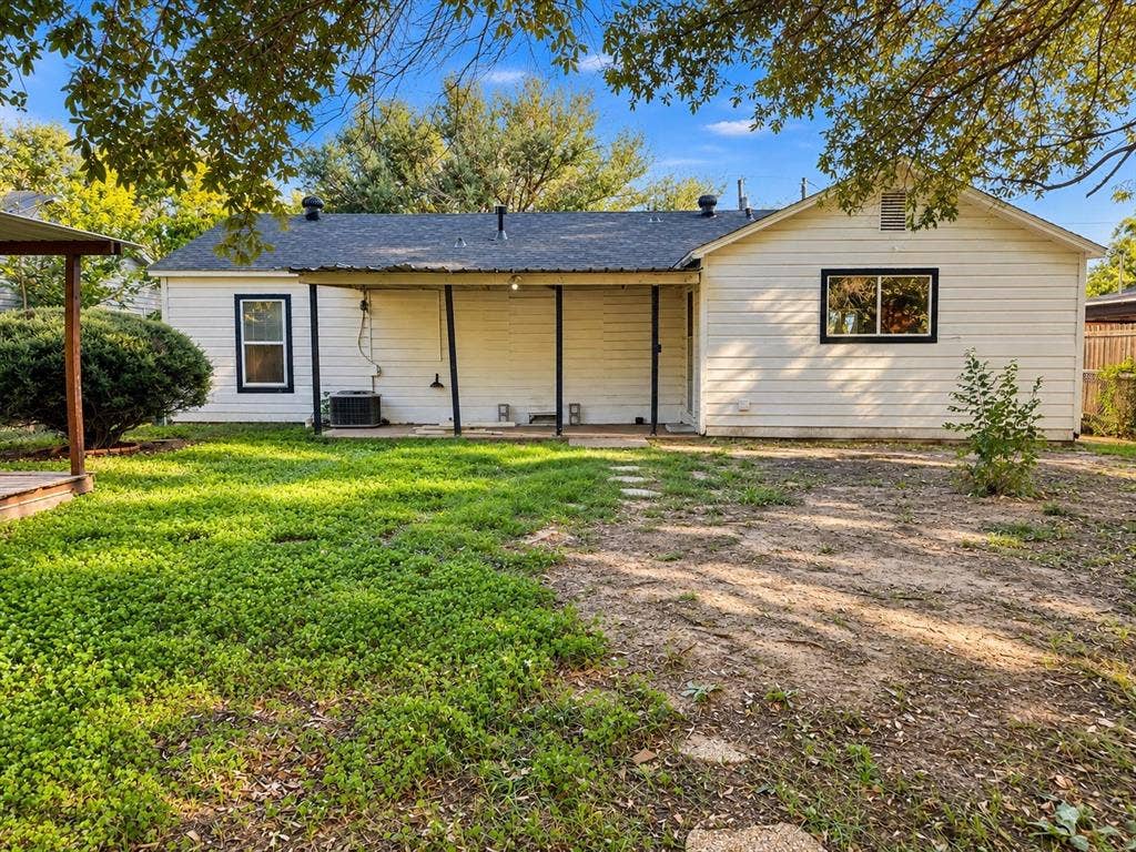1817 N Alexander Street, Sherman, TX 75092 Established landscaping and mature trees add character to the home’s exterior.