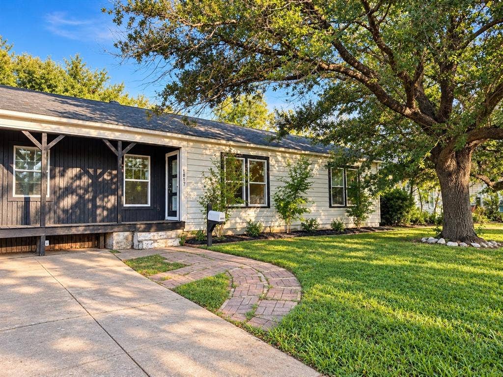 1817 N Alexander Street, Sherman, TX 75092 Enjoy a covered front porch, perfect for relaxing and enjoying the outdoors.