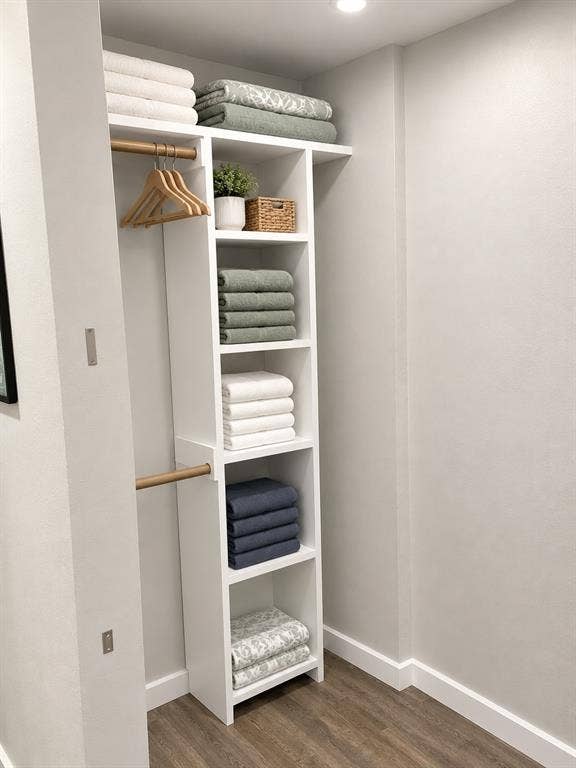 1579 Eastside Lake Road, Graham, TX 76450 Closet featuring white built-in shelving, wood-finish hanging rods