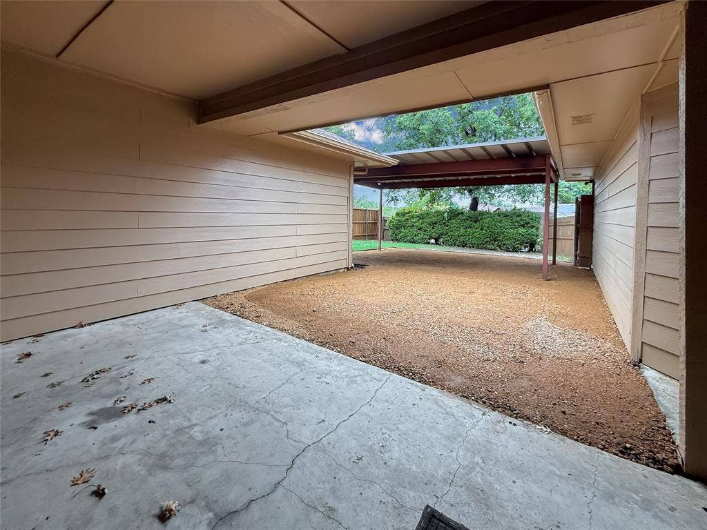 305 N Cottonbelt Avenue, Wylie, TX 75098 Covered concrete patio with horizontal siding and an attached metal-framed pergola
