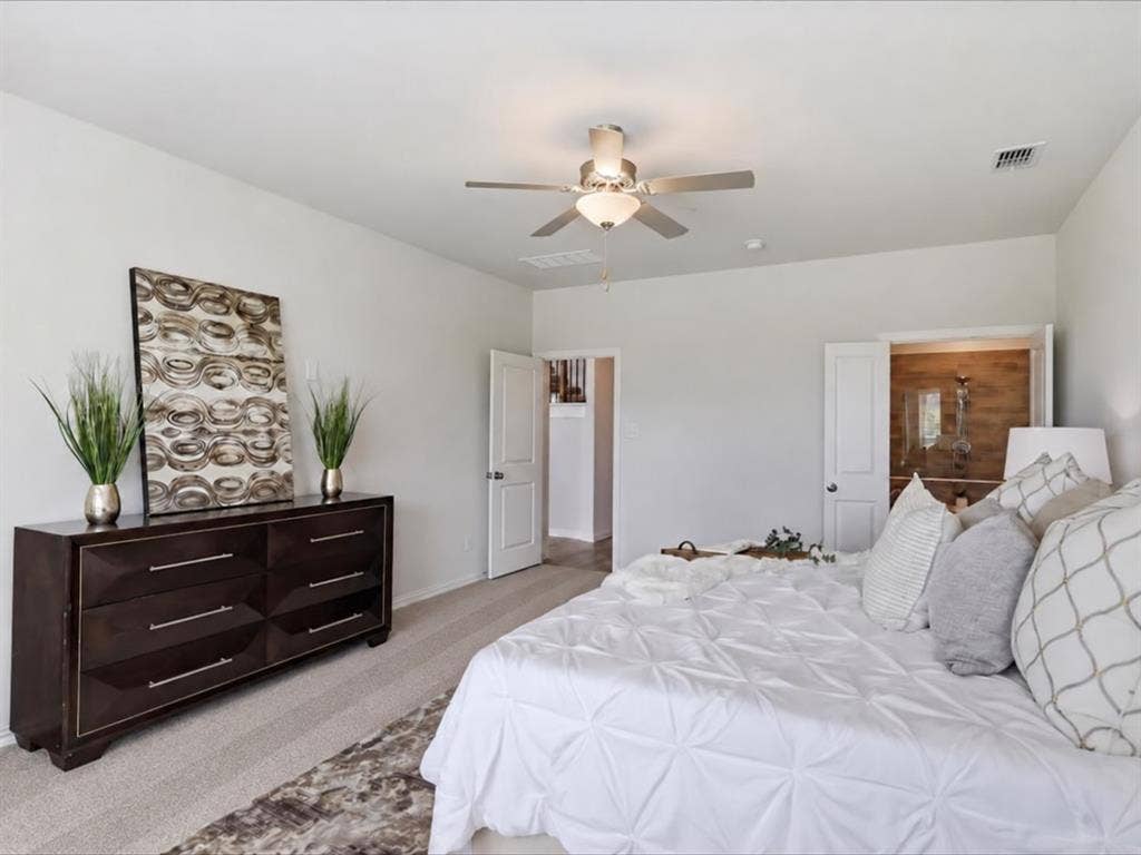 6417 Dolan Falls Drive, Northlake, TX 76226 Room featuring neutral wall tones, wall-to-wall carpeting, a multi-blade ceiling fan with integrated lighting, and white interior doors