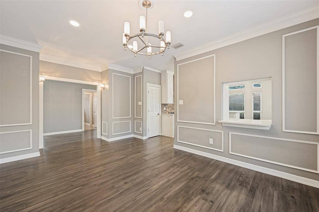 This dining area provides space for large or small gatherings and has a handy passthrough to the kitchen.