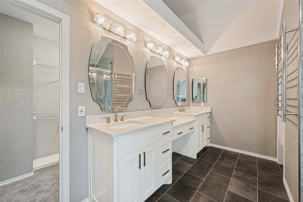 Beautiful mirrors grace the double sink dressing vanity.