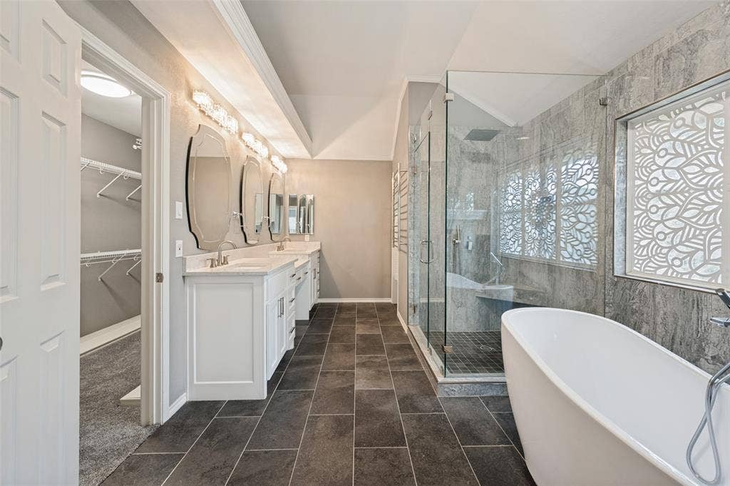This bathroom provides ample area for two people to dress without being crowded. On the wall next to the shower, you will see a heated towel rack.  Now, that is luxury.
