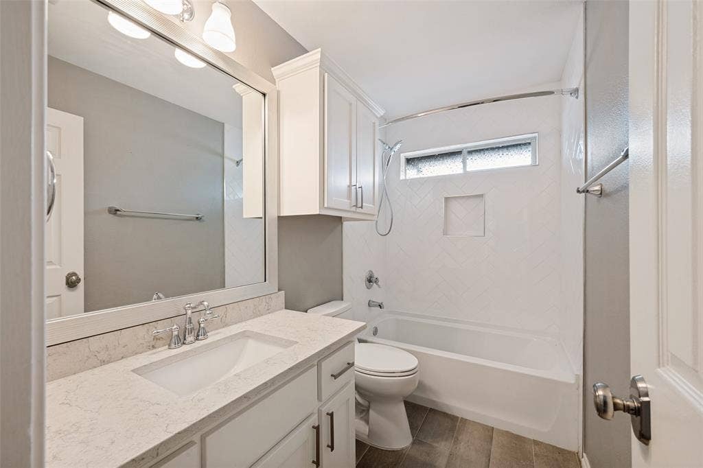 This bathroom sits between 2 bedrooms on the south side of the house. It has a motion sensor on a switch which turns on a tiny light to illuminate the room during those late night trips to the bathroom.