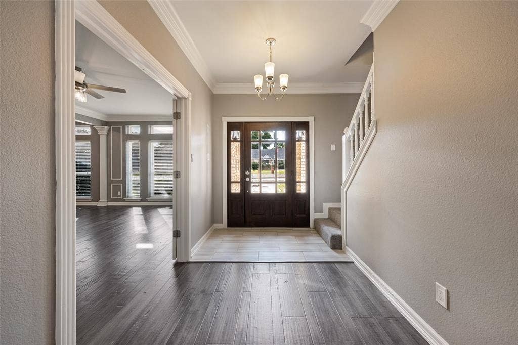 An inviting entrance with a wide hallway welcomes your guests.