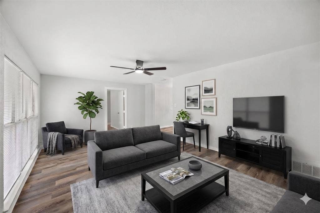 1605 Proctor Drive, Grand Prairie, TX 75051 AI IMAGEINED - Living area featuring wood-finish flooring, white walls, and a contemporary ceiling fan