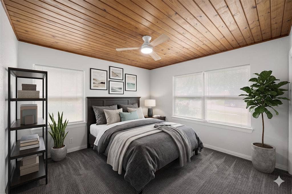 1605 Proctor Drive, Grand Prairie, TX 75051 AI IMAGINED - Wood paneled ceiling with a central ceiling fan fixture, accompanied by light gray walls and dark gray patterned carpeting