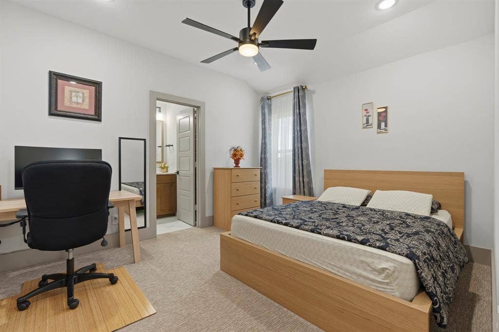 12173 Deer Trail, Frisco, TX 75035 Neutral-toned carpeted room featuring recessed lighting, a ceiling fan with integrated light fixture, and an entry to an interior bathroom