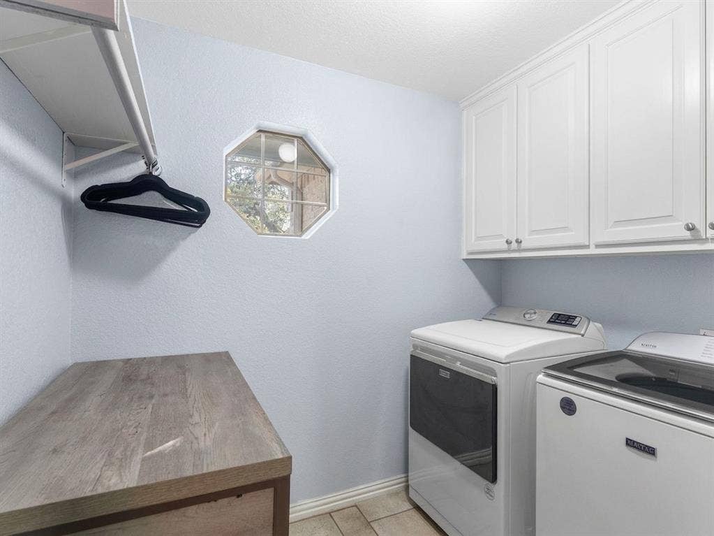 3103 Rim Rock Court, Granbury, TX 76049 Laundry room located within steps of kitchen