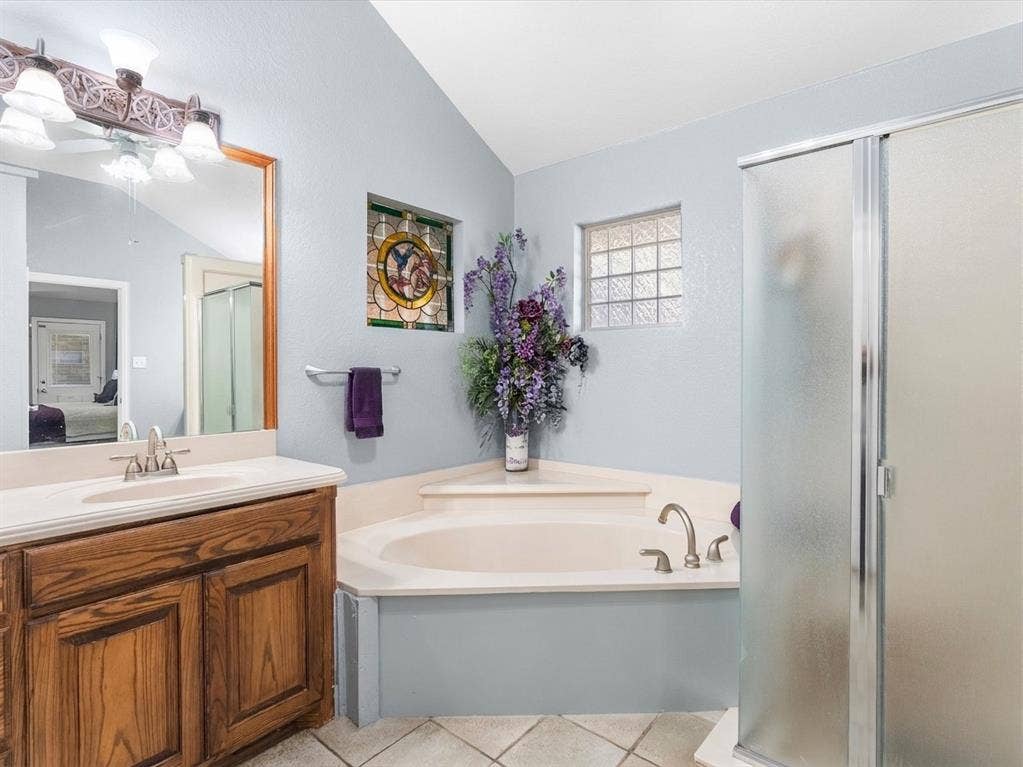 3103 Rim Rock Court, Granbury, TX 76049 Primary bathroom with garden tub and separate shower