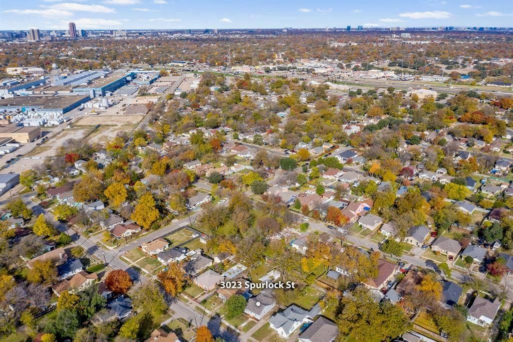 3023 Spurlock Street, Dallas, TX 75223 Aerial perspective of the residential property situated within a mature, tree-lined neighborhood
