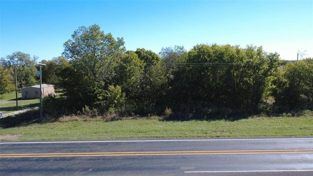147 Private Road 4330, Greenville, TX 75401 Cleared parcel of land featuring mature trees and established vegetation